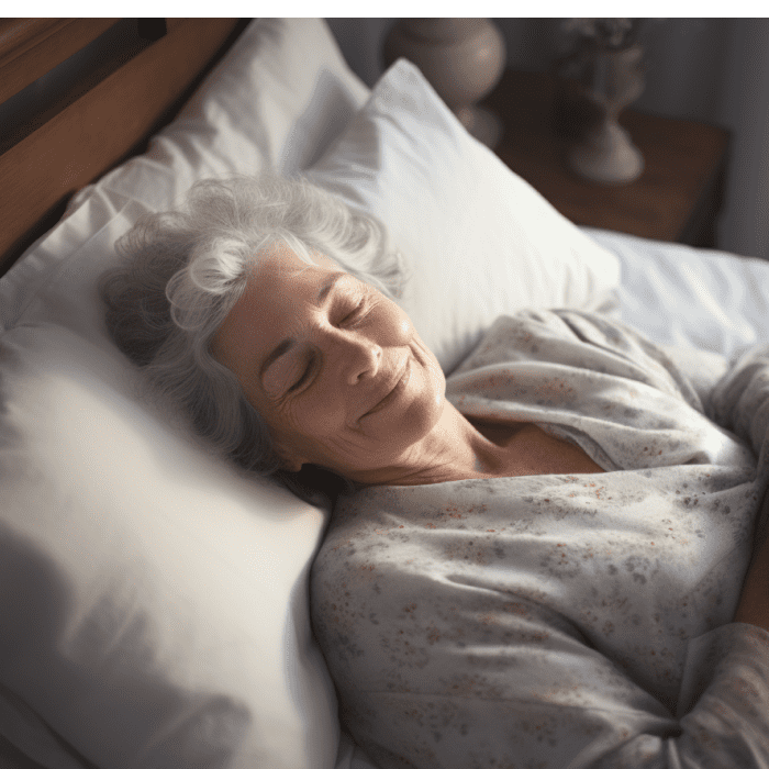 Old lady sleeping calmly and peacefully on a comfortable white bed